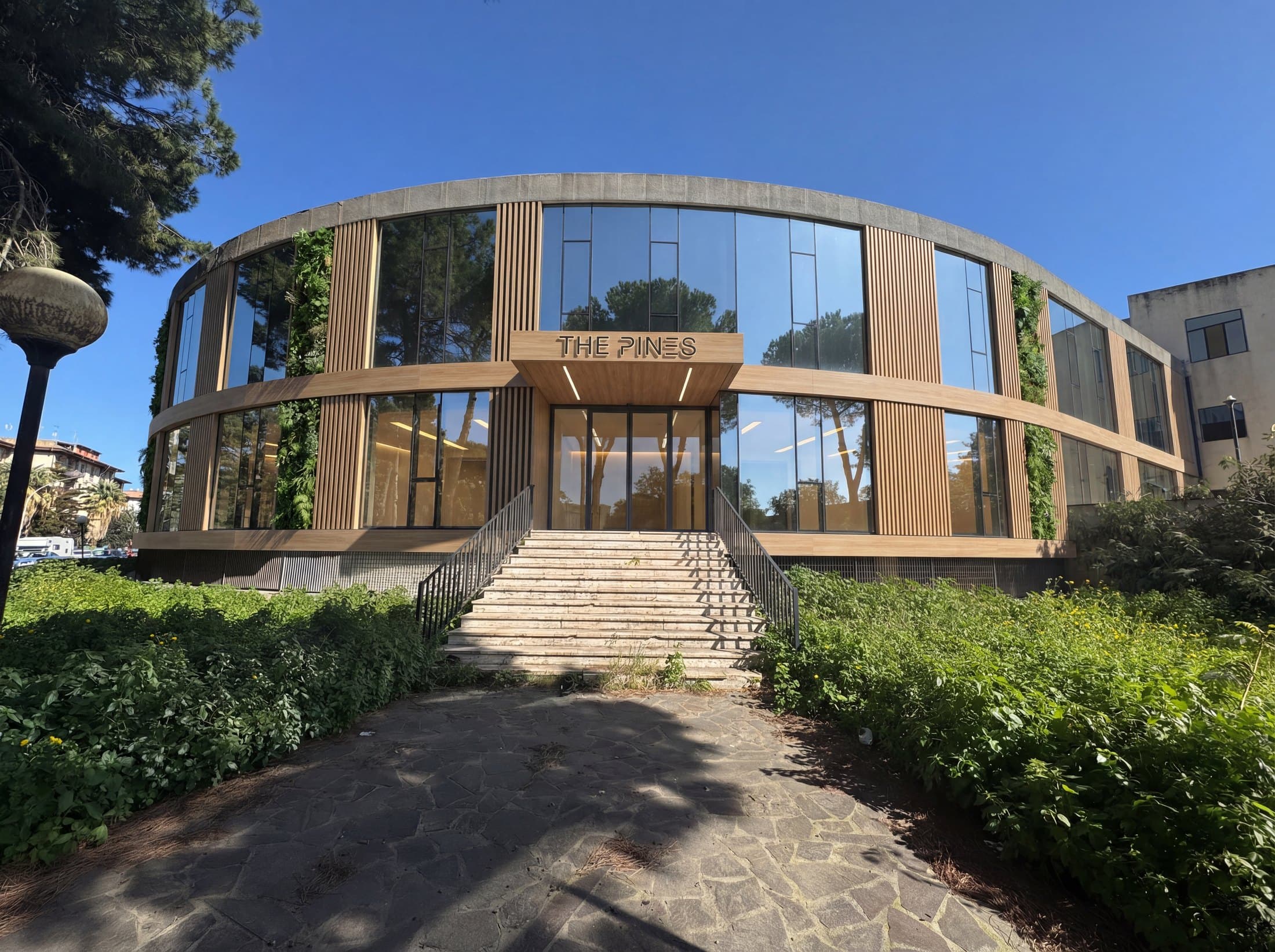 Commercial building exterior render with rounded glass facade and real estate repositioning concept