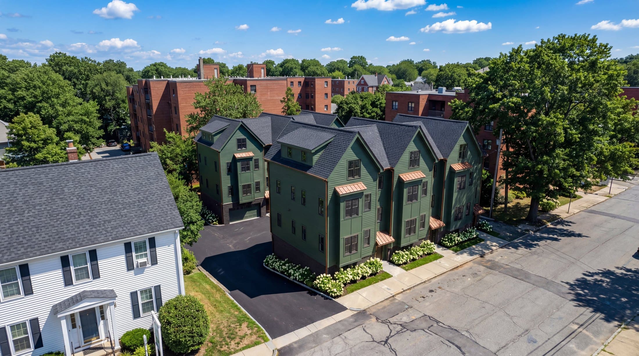 Aerial render of green townhomes prepared for property development marketing